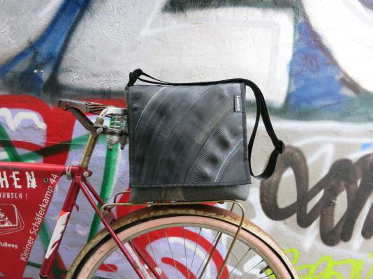 Upcycling bag made from used motorcycle hose and amry tent linen